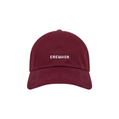 A plum colored Erewhon dad hat with the brand name 'EREWHON' embroidered on the front.